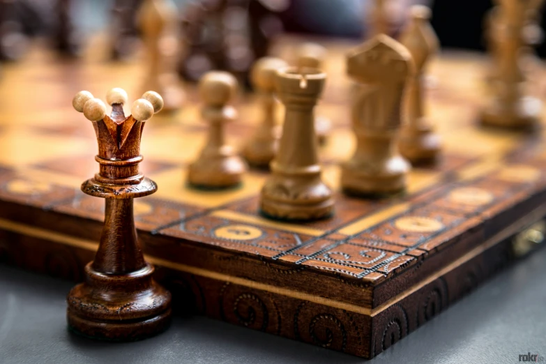 a close up of chess pieces on a board