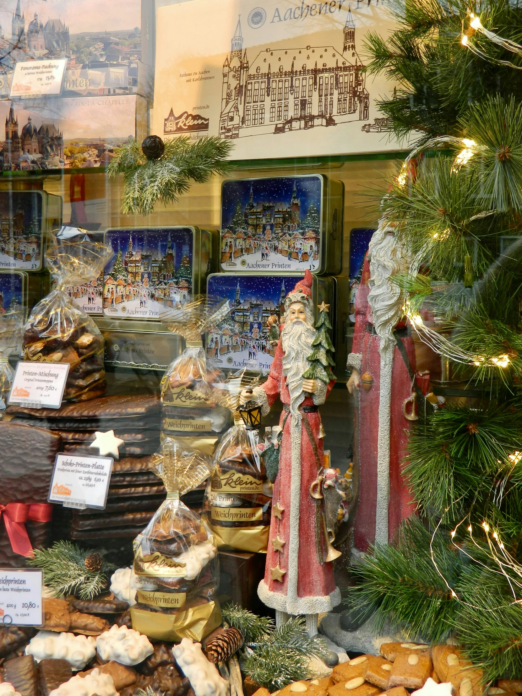 a christmas display window filled with many holiday food