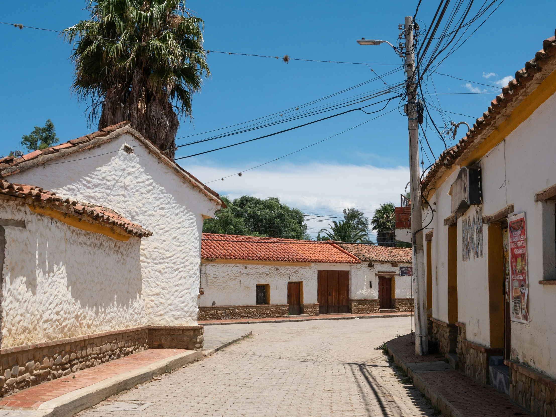 an empty alley in an adobe style village