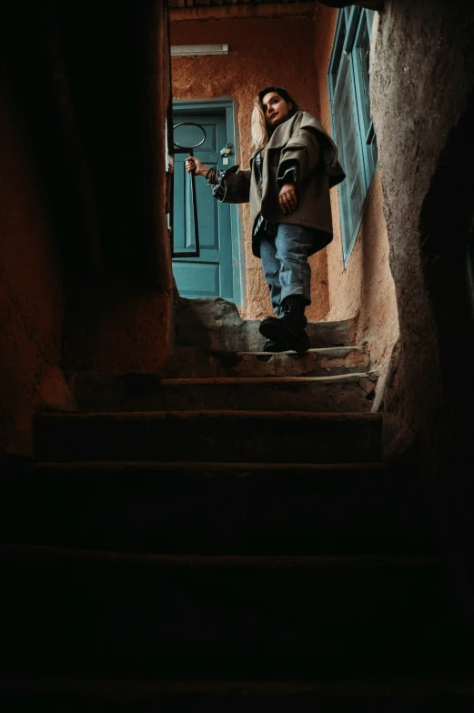 a man is walking down some steps by the door