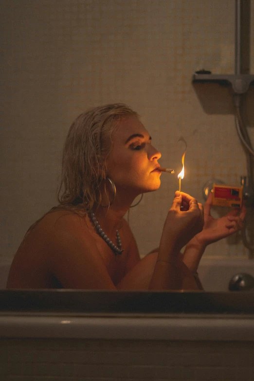 a  woman with a candle in her mouth smoking