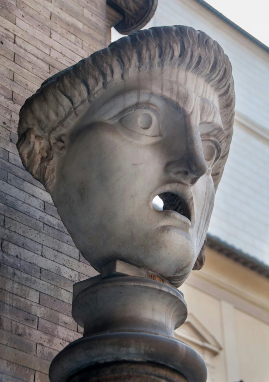 the front face of a large statue on a building