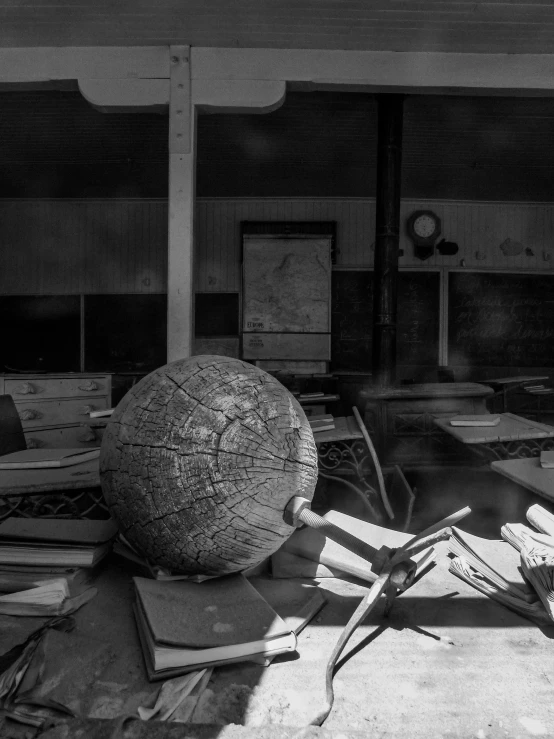 black and white pograph of desks with various items on top