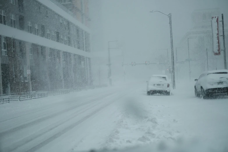 two cars on a snow covered road