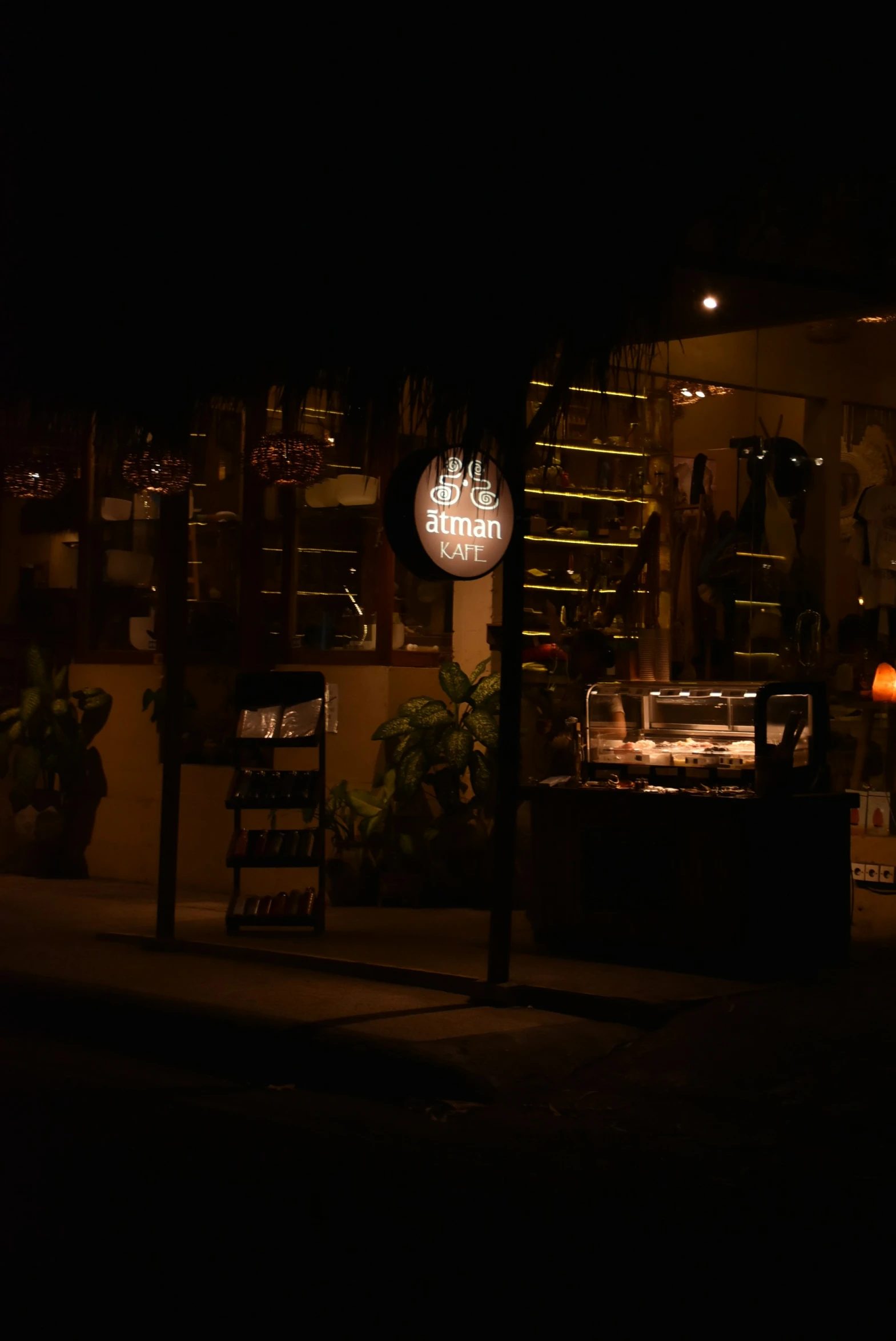 this is the outside of a bar with an illuminated sign