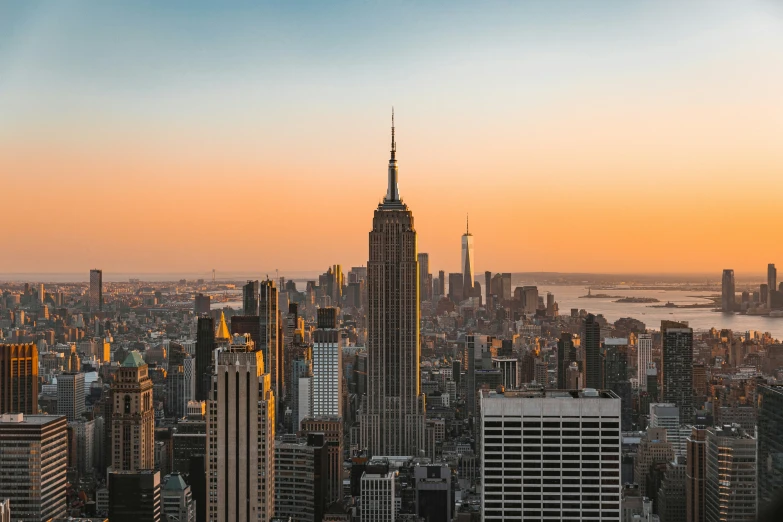 the empire building and surrounding buildings at sunset