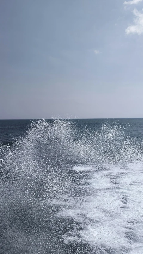 a jet ski being launched from the water with white spray