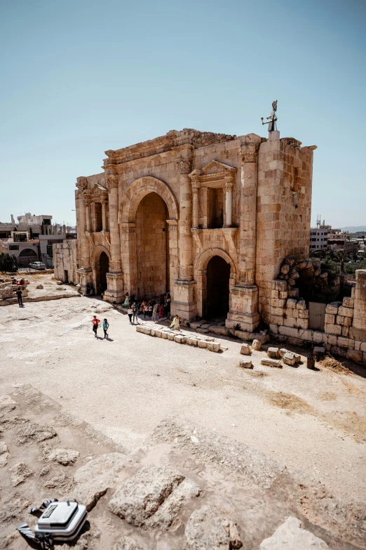 people on the ruins at an ancient city