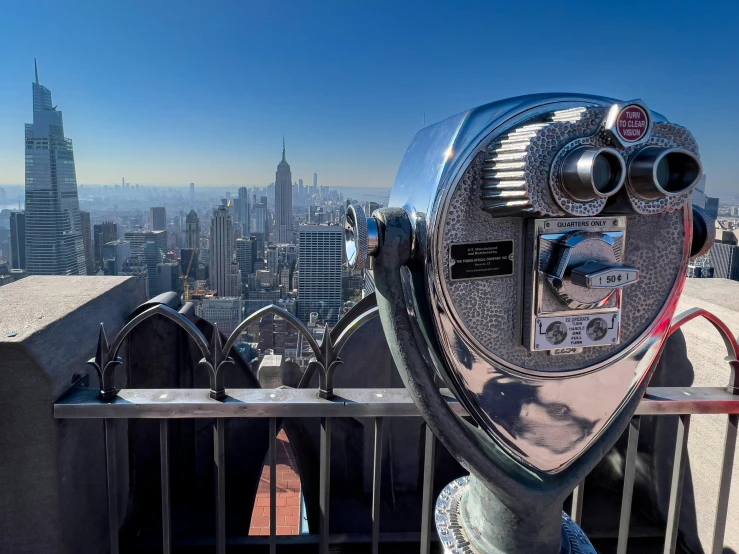 an analog parking meter on top of a building