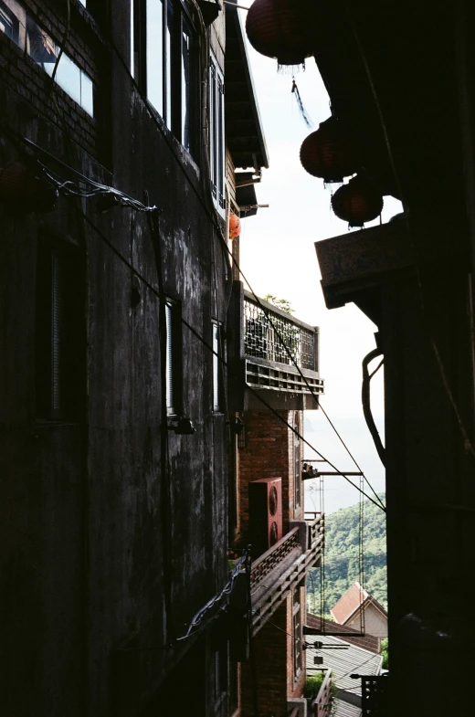 an empty alley way leading to a few buildings