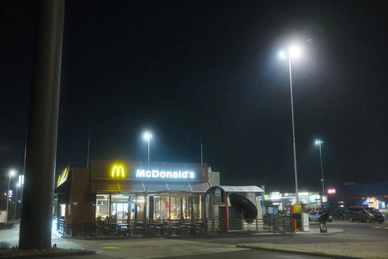 the lit up mcdonald's at night with no one