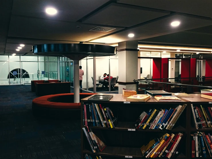 a book liry in the corner of a large room