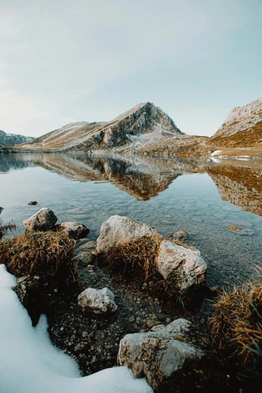 the view of a mountain that is covered in snow