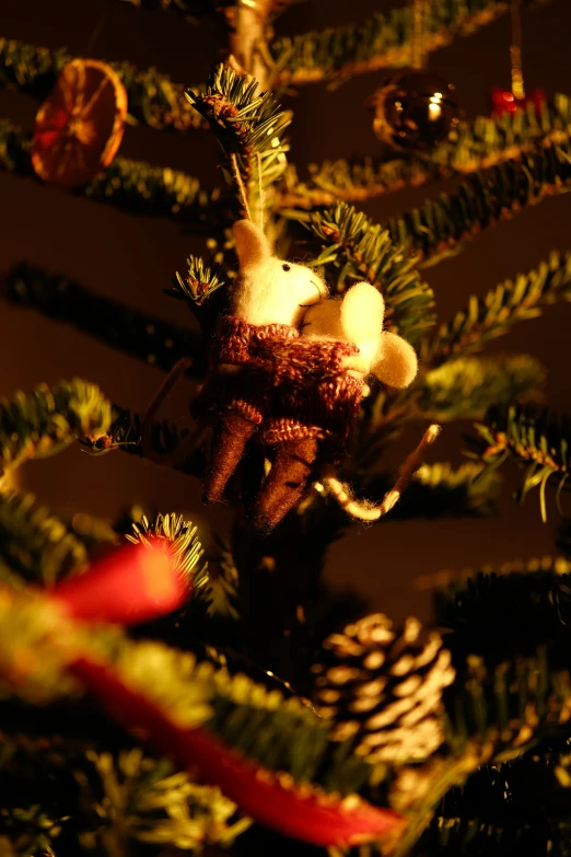 the ornaments on a christmas tree are all shiny and deformed