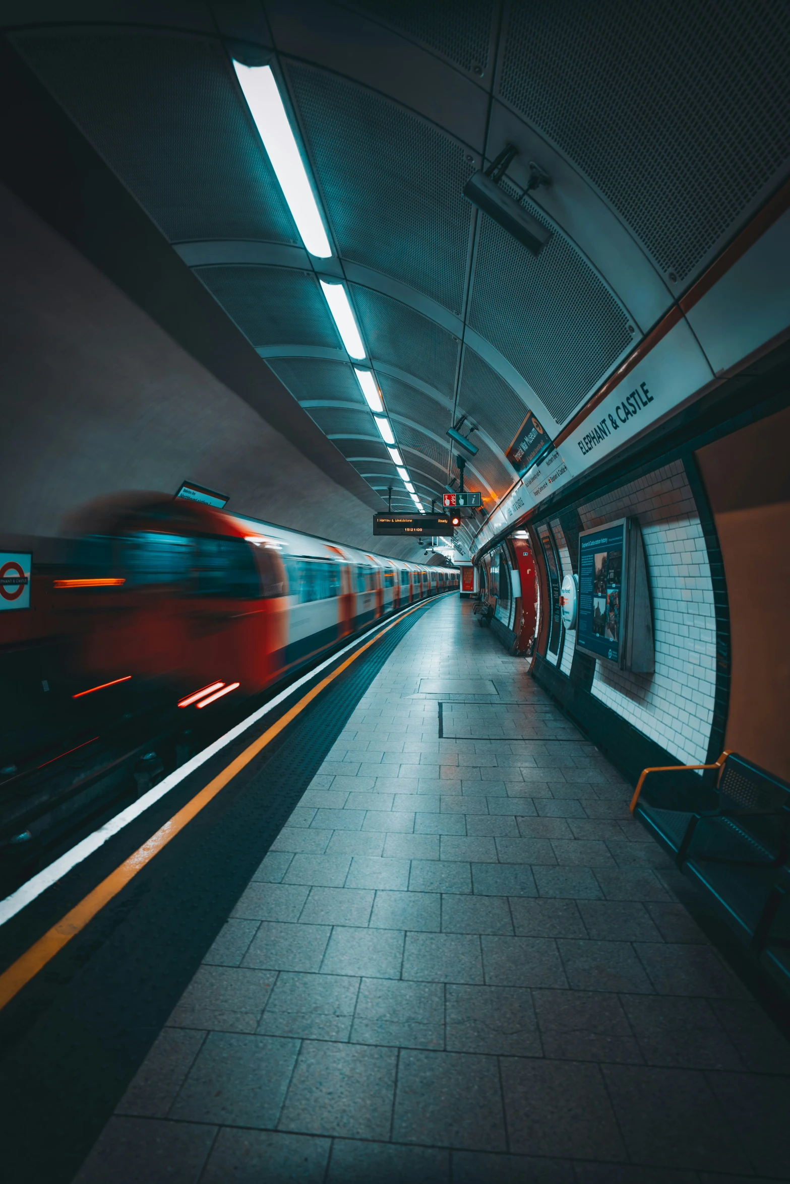 a subway train speeds through the station