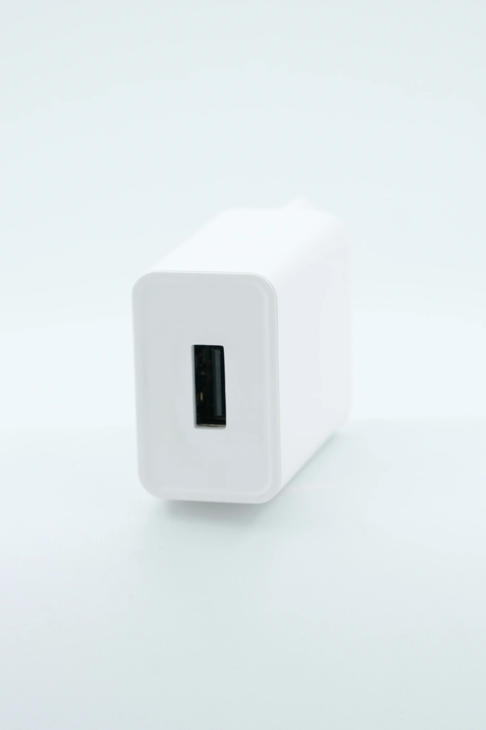 a white square object that has an electrical outlet inside