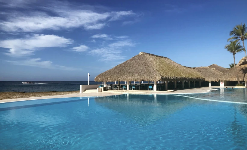 the resort has two large pools, a cabana and palm trees