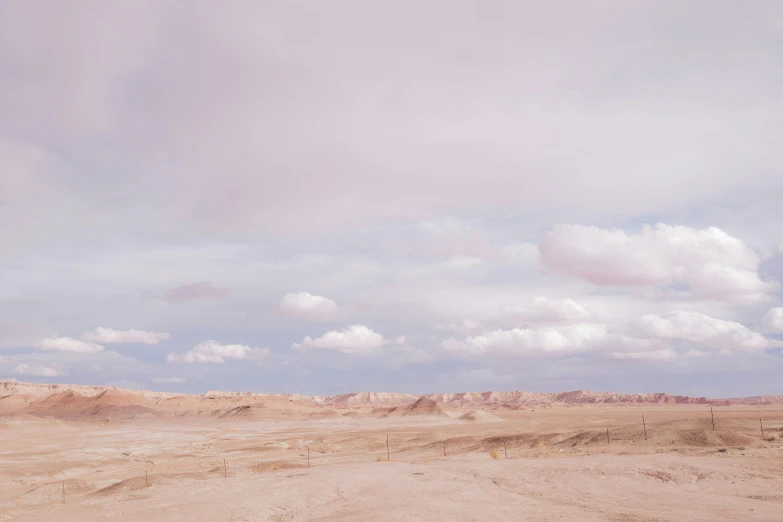 a landscape pograph of mountains, clouds and dirt