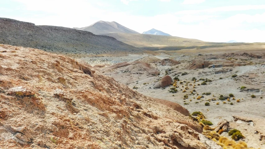 view from a rocky slope looking at the mountains