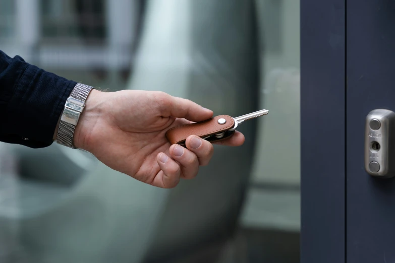 a person is using a cell phone in an elevator