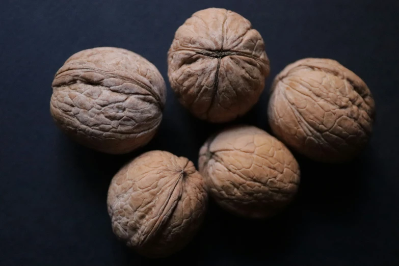 four pieces of walnut that have been cut in to bite