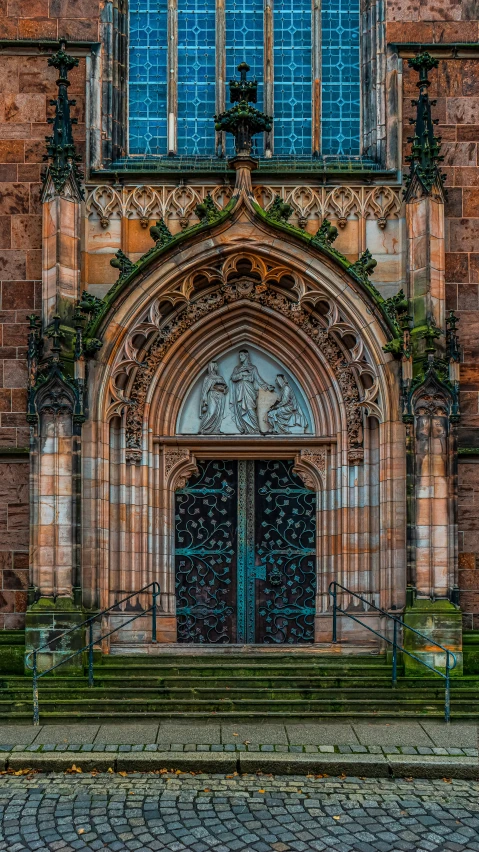 a cathedral with arched windows and steps leading up to it