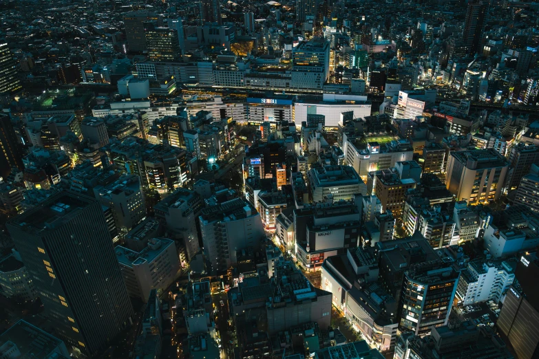 a very high rise area with lots of lights on at night