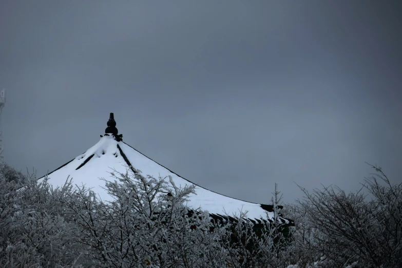 snow covered mountains are seen against a dark sky