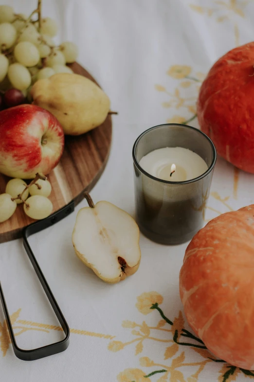 a table with an apple and some sliced apples