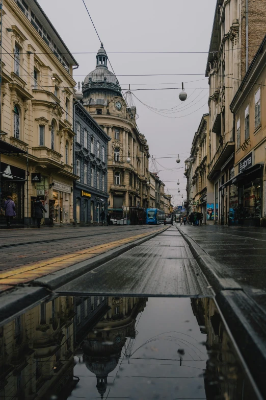 an empty street is shown in the rain