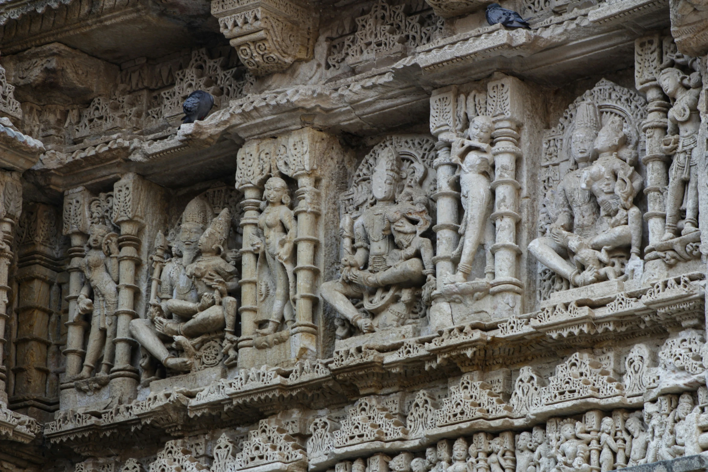 decorative carvings and sculpture displayed on the outer wall of a building