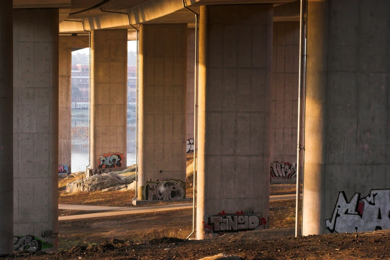 there are several empty concrete pillars on this street