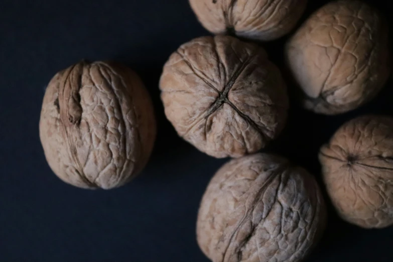 walnuts are shown laying on a table