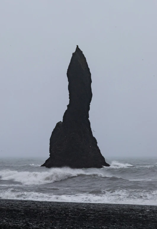 an outcropping of an ocean stack in the distance