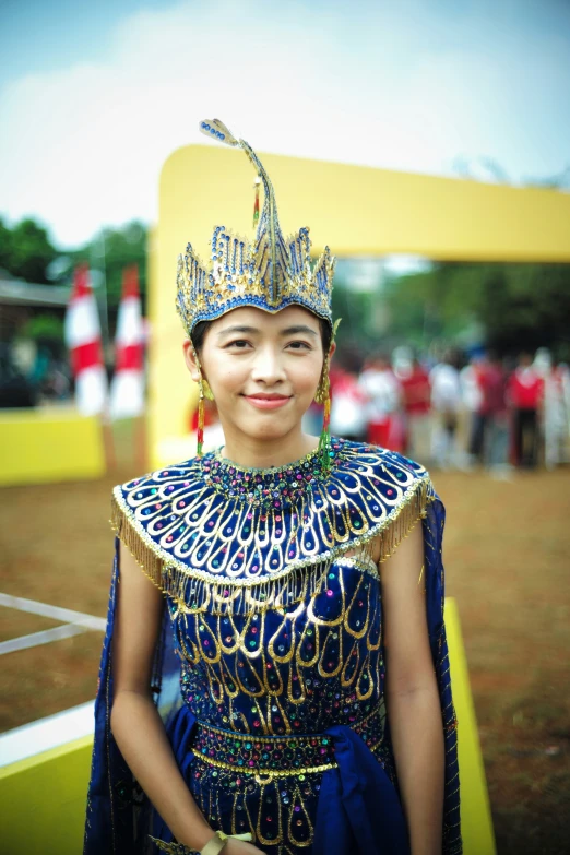 a woman in an elaborate outfit posing for a po