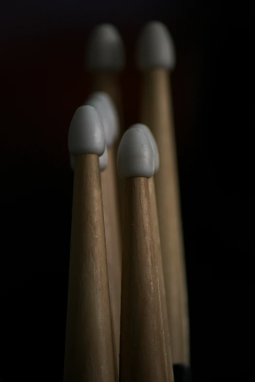 four toothbrushes that are lined up together