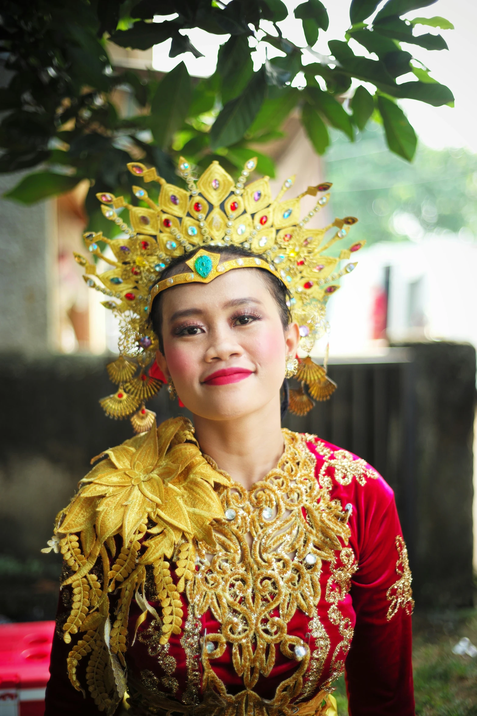 a woman wearing an elaborate golden head dress