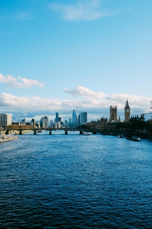 a river flowing through a city surrounded by tall buildings