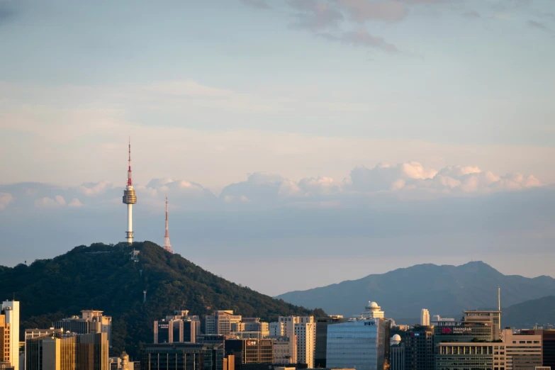 a mountain with buildings below and in front