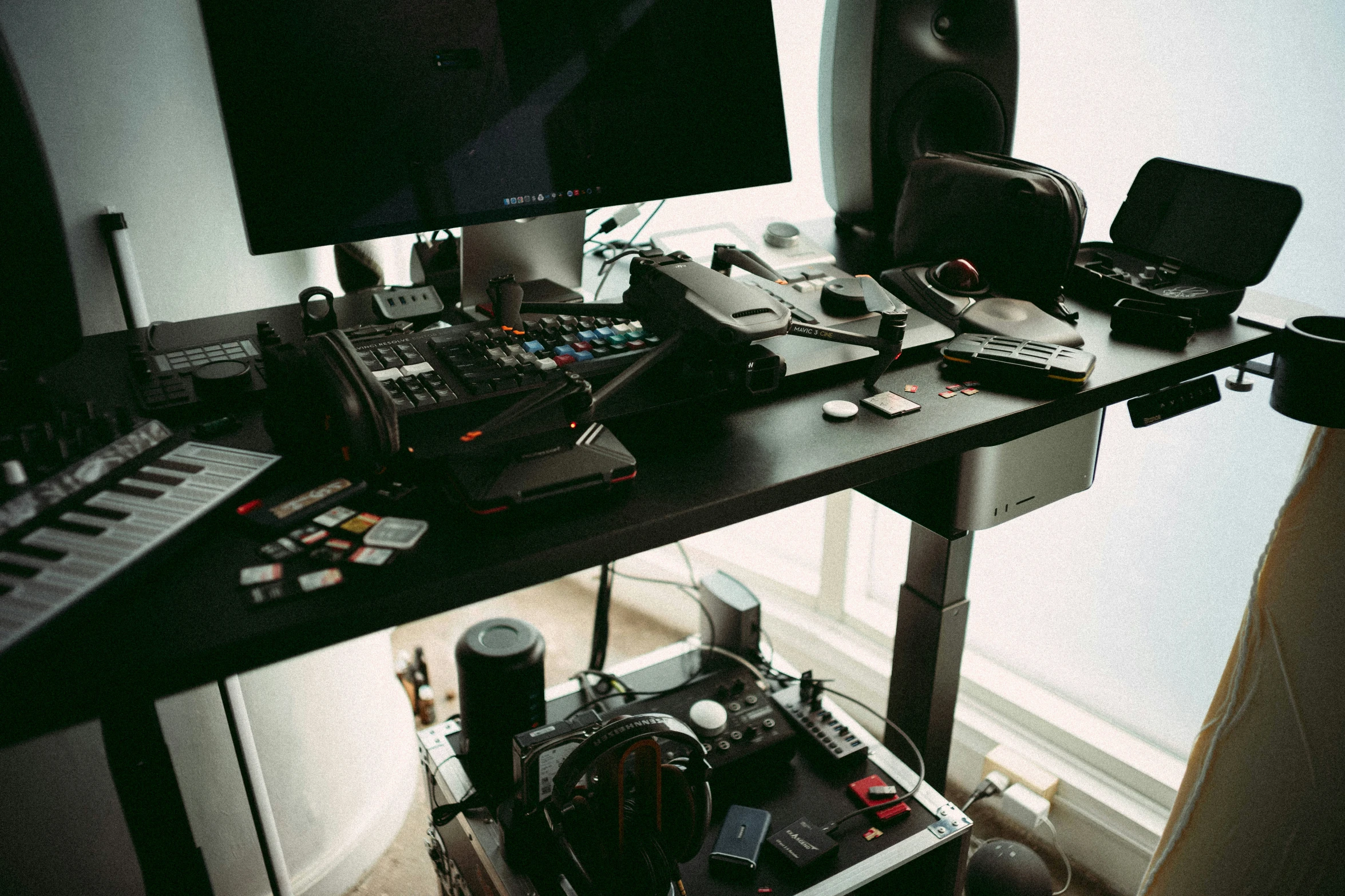 a table with sound equipment and various speakers