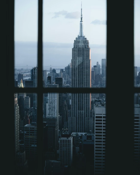 a view from a window of buildings and skyscrs