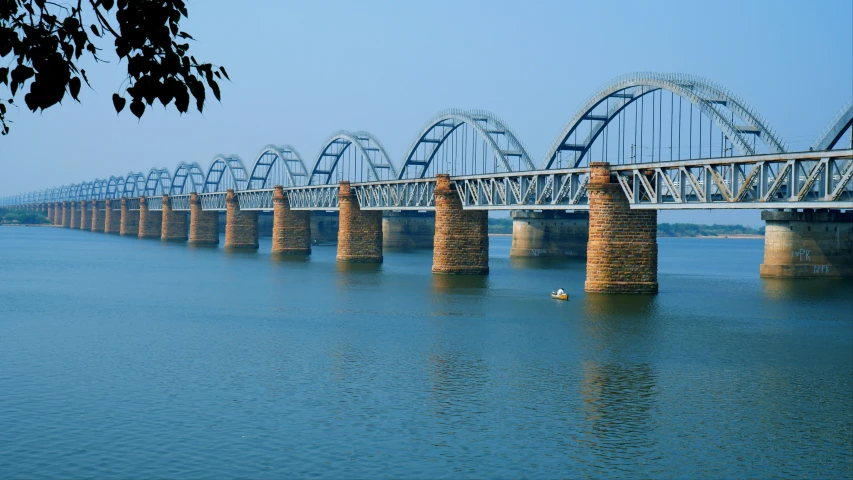 there are several rail bridges crossing across the water