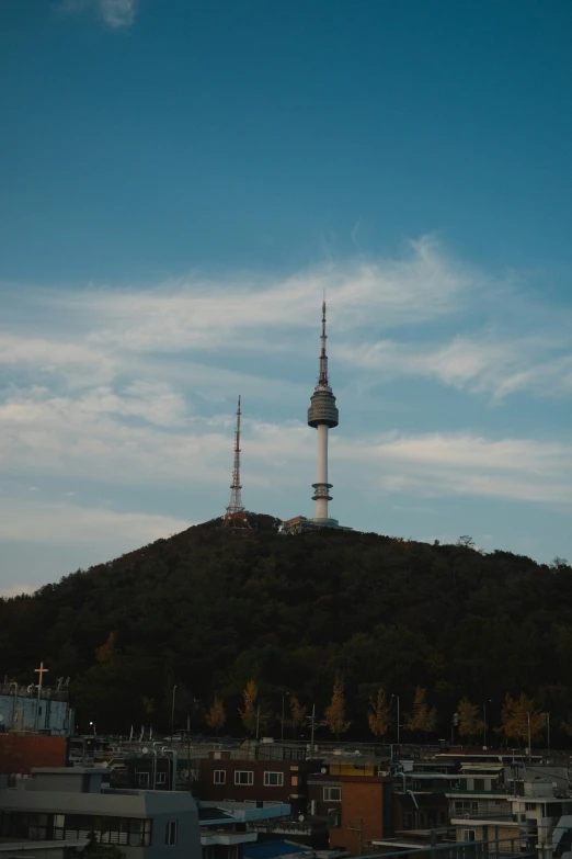 a very tall building on a hill by itself