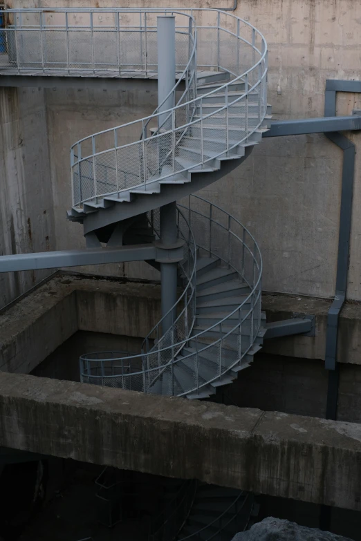 a staircase with a gate to exit it into a trench