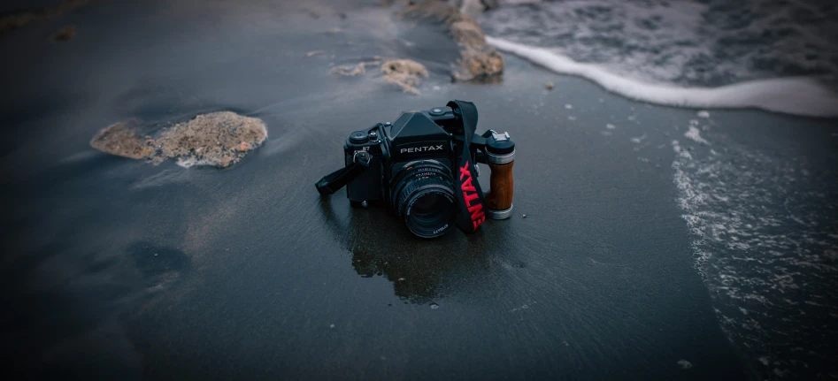the camera is on the beach near the ocean