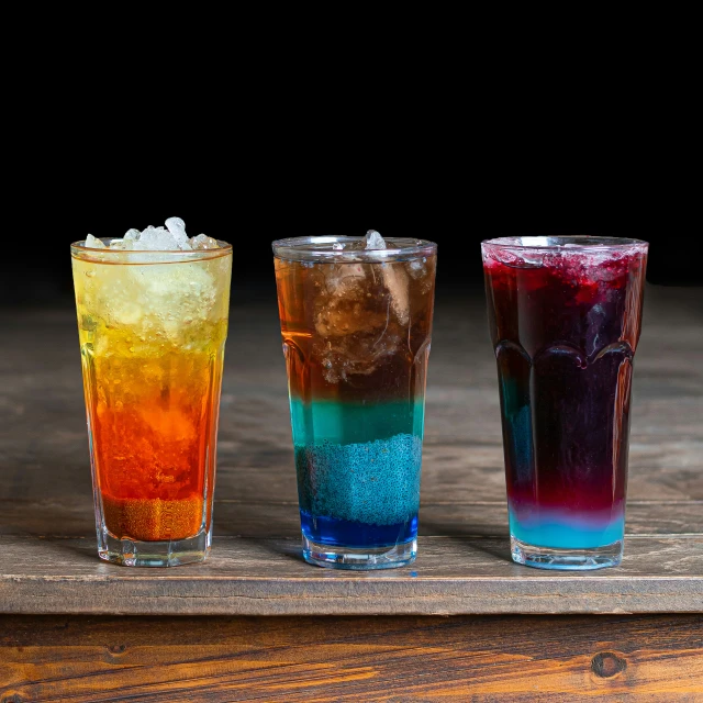 three types of drink sitting on top of a table