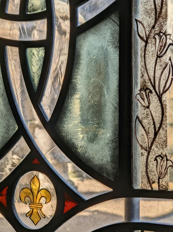 close up of decorative glass panel with fleur de liss