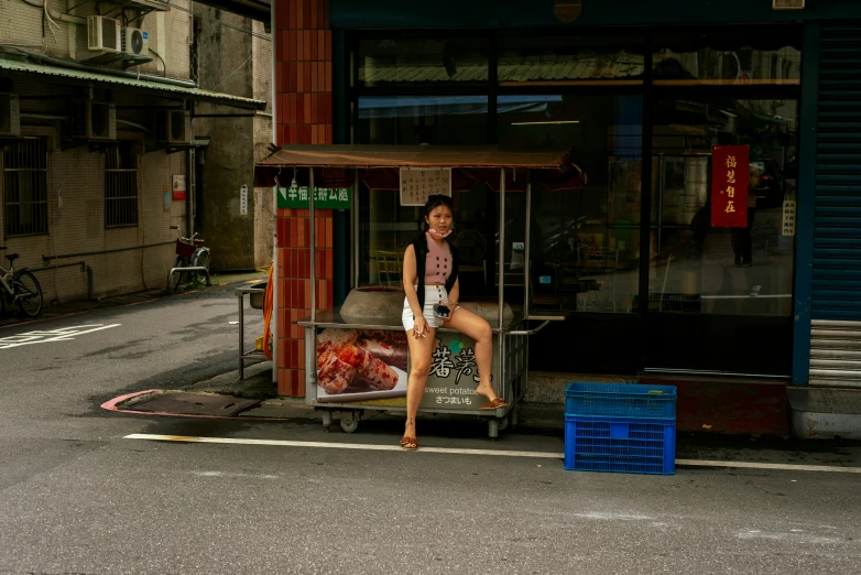 a woman sitting on top of a bench