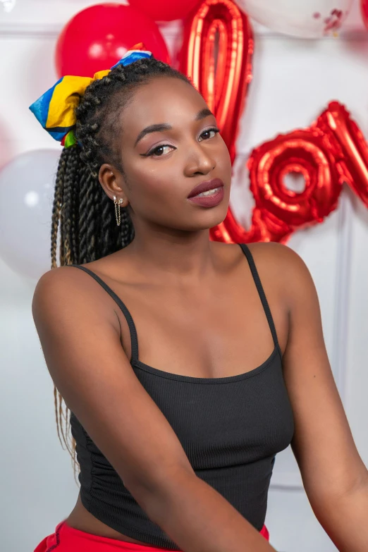 a woman in black top posing for a po