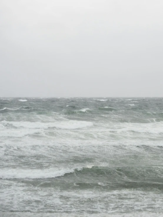 a man on a surfboard that is in the water